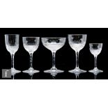 A late 19th Century part suite of clear cut crystal drinking glasses to include champagne, red wine,