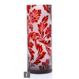 A large later 20th Century glass vase of cylindrical form, cased in ruby over clear crystal and