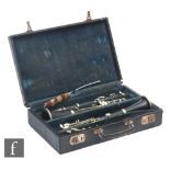 A pair of early 20th Century clarinets by Buffet A Paris, ebonised case with nickel fittings, in