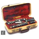 A 1930s or later Selmer Clarinet, ebonised case with nickel fittings in fitted plush lined case.