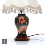 A small Moorcroft Pottery table lamp decorated in the Oberon pattern designed by Rachel Bishop,