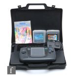 A Sega Game Gear in carry case with six games.