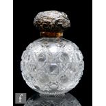 A Stourbridge clear crystal table scent of spherical form decorated with a hobnail cut pattern below