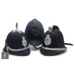 A Kidderminster police helmet, spike top, in sectioned blue cloth with badge and chin strap, a