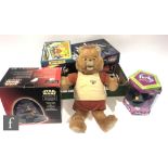 A collection of assorted toys to include a boxed Furby, Teddy Ruxpin, a boxed Bendy Mickey Mouse,