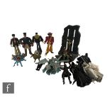 A collection of action figures, McFarlane Beatles and ToyBiz Lord of the Rings, unboxed.