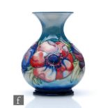 A small Moorcroft vase of globular form with a squat flared neck decorated in the Anemone pattern,