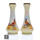 A pair of early 20th Century Locke & Co Worcester spill vases each decorated with a hand painted
