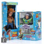 Two Thinkway Toy Story toys, Ultimate Talking Action Figure Buzz Lightyear, and Talking Woody,