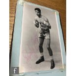 A mid 20th Century autograph book mounted with various signed photographs of boxers, also poems