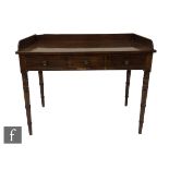 A George IV mahogany tray top washstand, fitted with a single long drawer, on ring turned tapering
