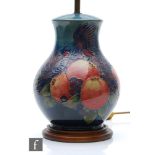 A Moorcroft Pottery table lamp decorated in the Finches pattern designed by Sally Tuffin, marks