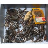 A large collection of 19th and 20th Century cabinet keys, including a watch winder. (qty)