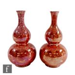 A pair of 1930s Norfolk Pottery for Lawleys double gourd vases decorated in a sponged orange lustre,