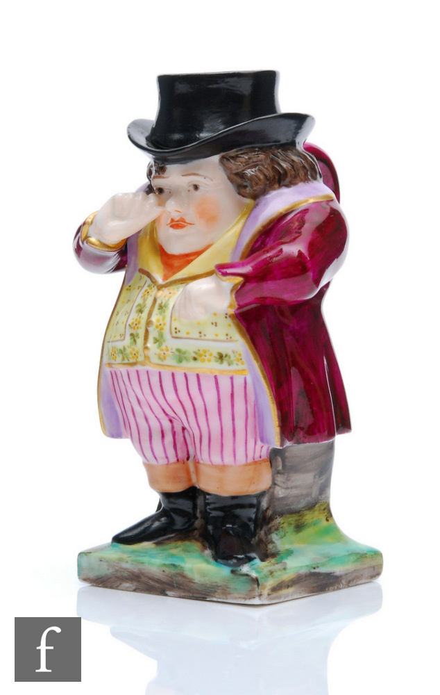 A 19th Century King Street Derby model of a snuff taker with crimson overcoat, striped breeches