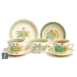 A pair of Clarice Cliff Lynton shape trios circa 1936, comprising teacup, saucer and side plate with