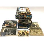 Twenty two assorted plastic model kits, mostly military, to include Tamiya, Revell and JB Models,