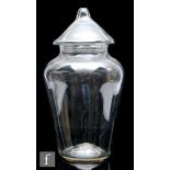 A 19th Century clear glass leech jar, the shouldered ovoid body with a conical cover with integral