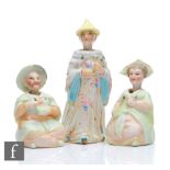 Three late 19th Century bisque East Asian nodding figures comprising a seated lady and gentleman,
