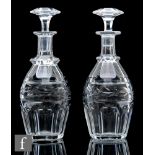 A pair of 20th Century Baccarat clear crystal decanters of swollen ovoid form with slice cut base,
