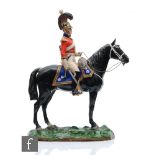 A large Sitzendorf model of soldier on horseback, painted to the underside 1st Life Guards Order
