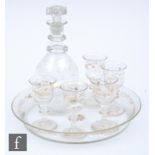A late 19th Century Continental liquor set comprising circular rimmed tray, five bell bowl glasses