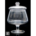 A 19th Century clear glass leech jar, the wide circular foot rising to a waisted capstan stem