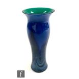 A contemporary Caithness vase of swollen sleeve form with an everted rim, the body cased in dark