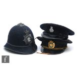 A Worcestershire Constabulary blue cloth policeman’s helmet with badge and chin strap, a