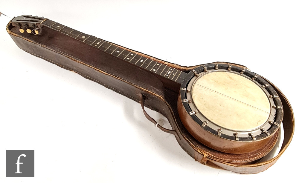 An early 20th Century six string banjo by George R Matthews in leather case, A/F.