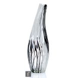 A contemporary art glass vase of tapered ovoid form, decorated with applied black and white pulled