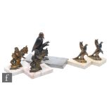 A pair of 20th Century bronzed spelter bookends, modelled as lovebirds perched on berry boughs,