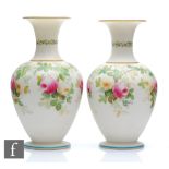 A pair of 19th Century Royal Worcester parian vases of globe and shaft form decorated with a band of