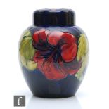 A Moorcroft ginger jar and cover decorated in the Hibiscus pattern, impressed mark, height 19cm.