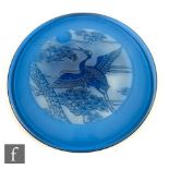 A later 20th Century Cameo glass plaque of circular section, cased in deep turquoise over clear