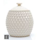 A Belleek storage jar formed as a pineapple, 5th period green mark (1955-65), height 18cm.