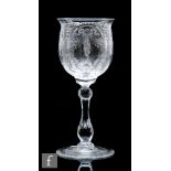 An early 20th Century Thomas Webb & Sons wine glass with a heavily cut thistle bowl decorated with