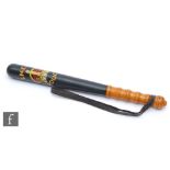A black painted policeman's truncheon for the L.N.E.R police, ribbed handle with leather strap,