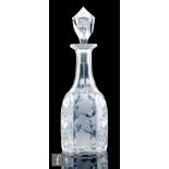 A 19th Century glass bludgeon decanter, circa 1855-80, the body cut with arched panels engraved with