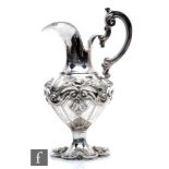 A Portuguese silver plated ewer, shaped circular foot with embossed shell decoration, below part