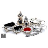 Two hallmarked silver boat shaped three piece cruet sets with a silver penknife and a drip collar,