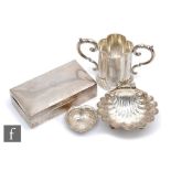 Four items of hallmarked silver, a cigarette box, a pedestal bon bon dish, a twin handled cup and