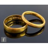 Two 22ct hallmarked wedding rings, total weight 10.5g, widths 6mm and 3.5mm. (2)
