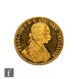 An Austrian 1915 four Ducat re-strike gold coin, 14g.