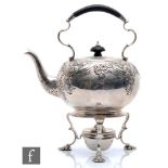 A hallmarked silver spirit kettle with conforming stand and burner, the stand raised on three pad