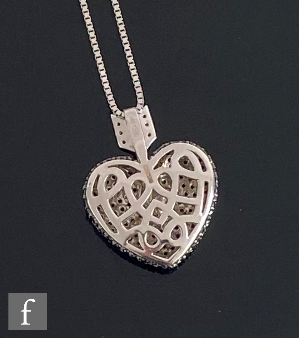 A modern 18ct white gold black and white diamond set pendant modelled as a black heart below a white - Image 6 of 9