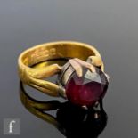 A 22ct wedding ring converted to a single stone garnet ring, weight 5.8g, ring size J 1/2, S/D.