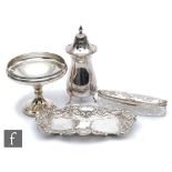 Four items of hallmarked silver to include a sugar castor, a small pedestal dish, a silver topped
