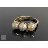An early 20th Century 18ct three stone spilt pearl ring, weight 2.9g, ring size P, A/F.
