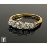 An early 20th Century 18ct diamond five stone ring, graduated old cut claw set stones, largest